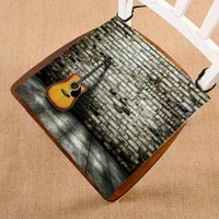 Gitara u praznoj praznom sobu cigla zidna sjedala jastučića jastučića sjedala jastuk